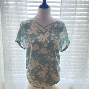 Blue floral top with a criss cross chest